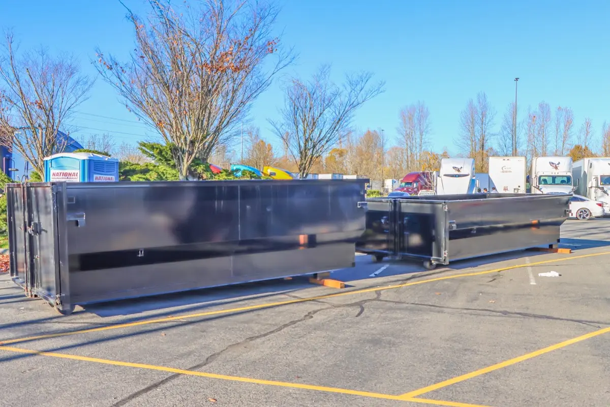 Professional dumpster rental service with roll-off container on residential driveway in Lower Pottsgrove